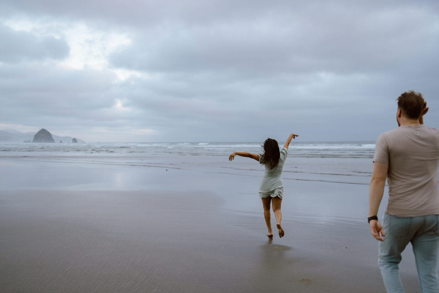 Couple getting engaged at Cannon Beach