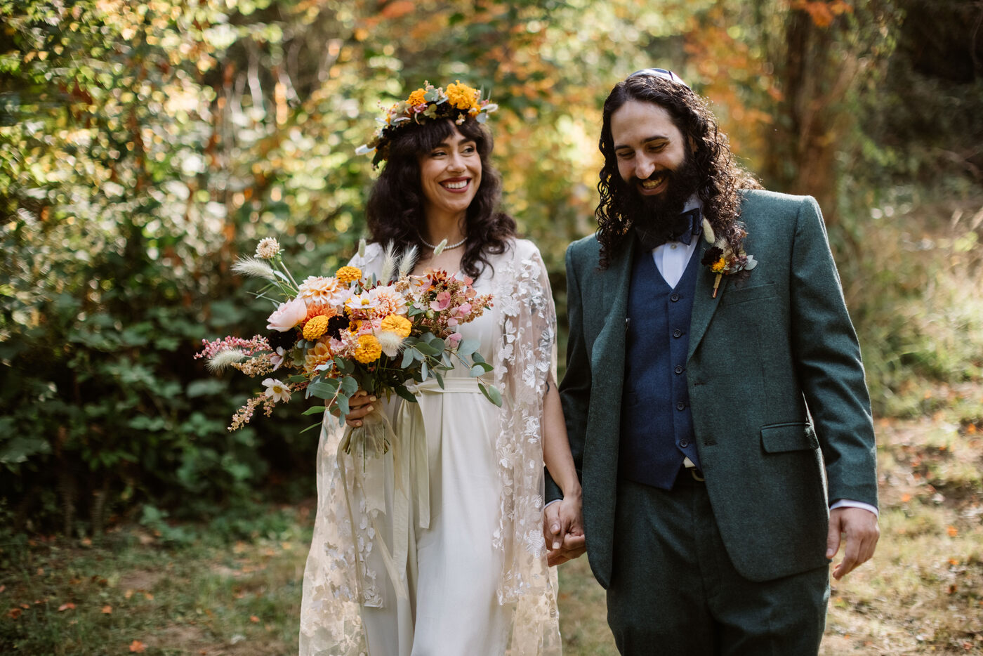Couple smiling and walking in the Hoyt Arboretum in Portland